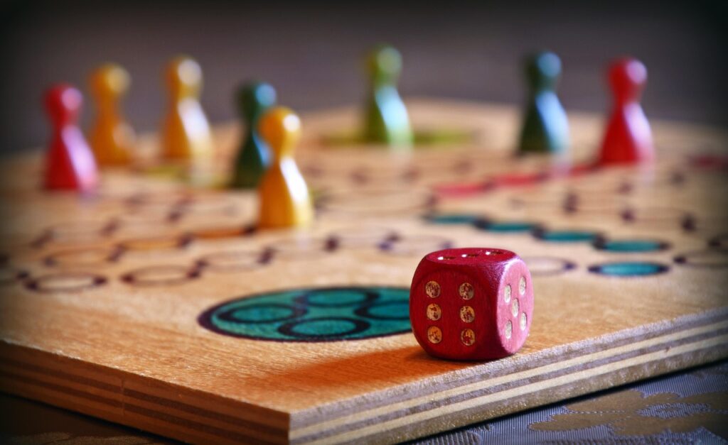 Colorful wooden board game with dice and player pawns, ideal for casual entertainment, parties, and fun game nights with friends and family.