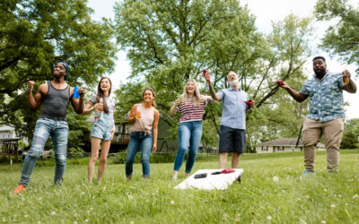 group of friends are playing games outside