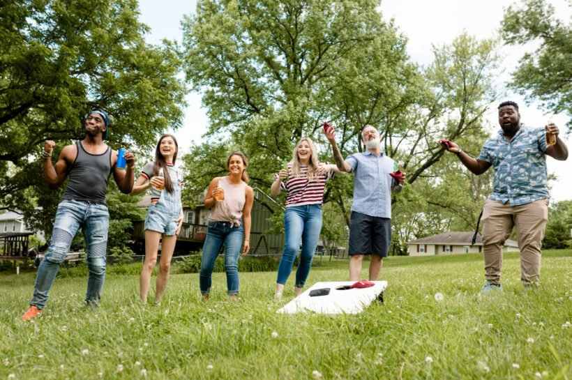 group of friends are playing games outside