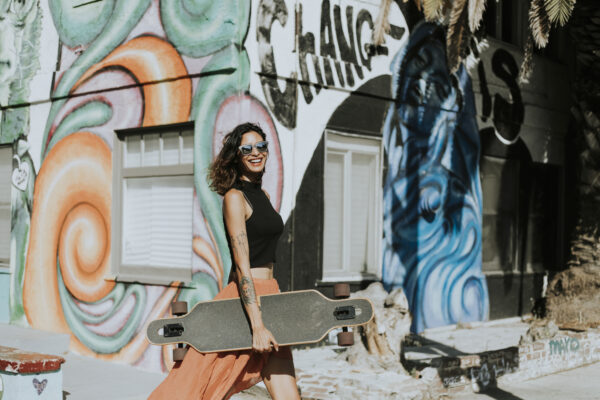 ool-woman-with-longboard-street-art