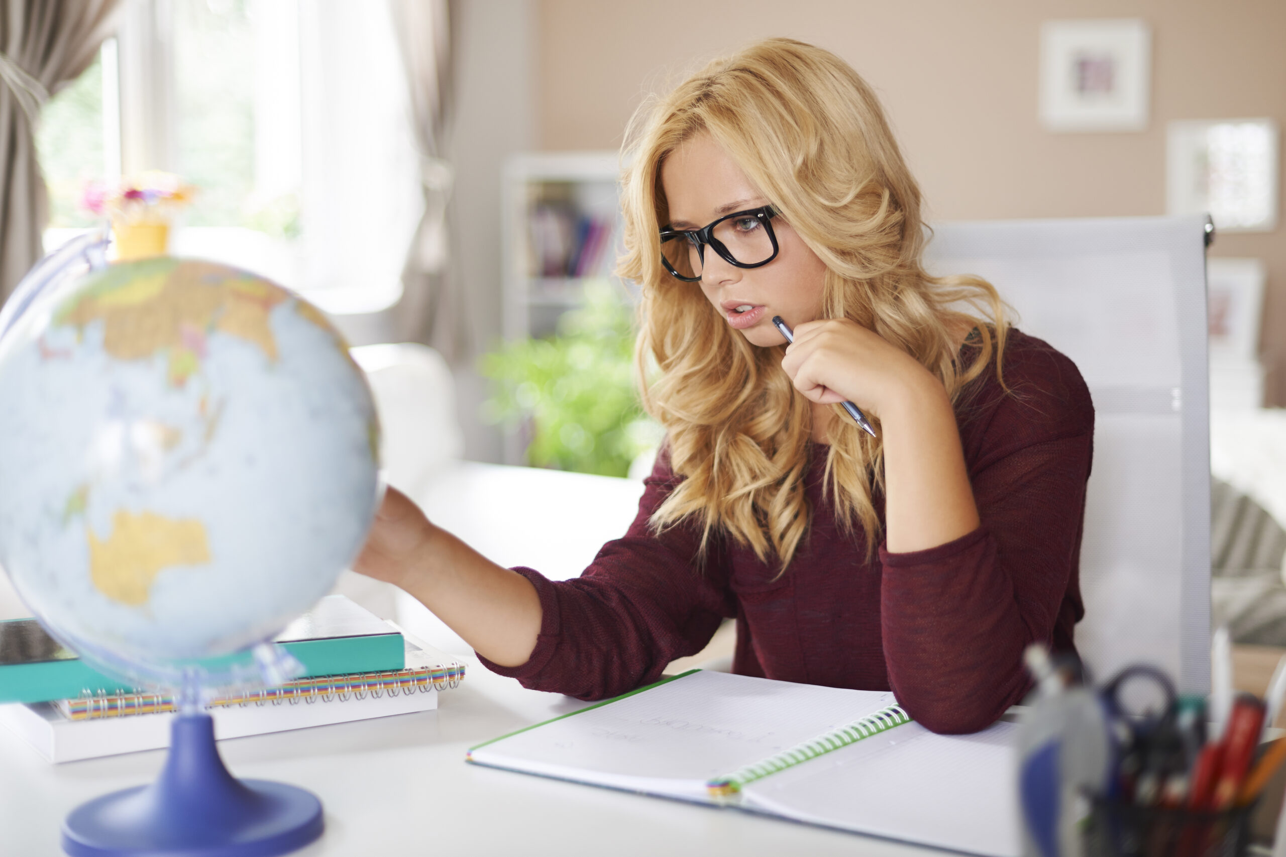 focus-girl-studying-globe-earth-home
