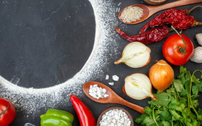 top-view-sprinkled-flour-circle-tomatoes-onions-rice-wooden-spoon-coriander-table-free-space-scaled